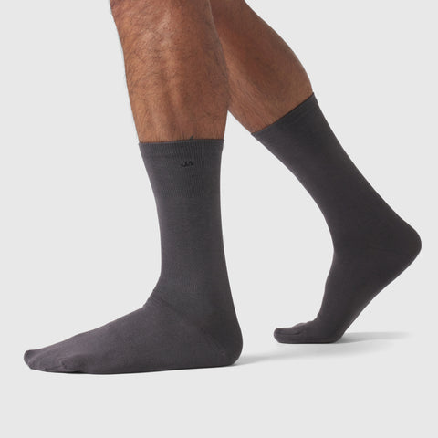 Men wearing grey Anytime Socks made from silky Pima cotton.