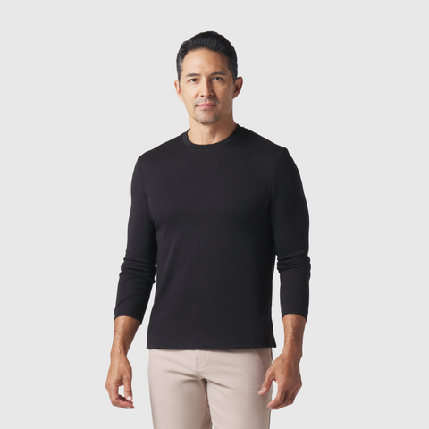 Precision Long Sleeve Tee in organic cotton, black color, modeled by a person, highlighting shoulder design and wrinkle-resistant fabric.