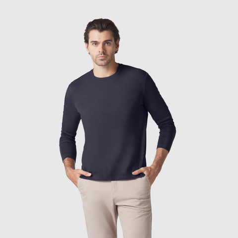 Precision Long Sleeve Tee in organic cotton, modeled by man in beige pants.