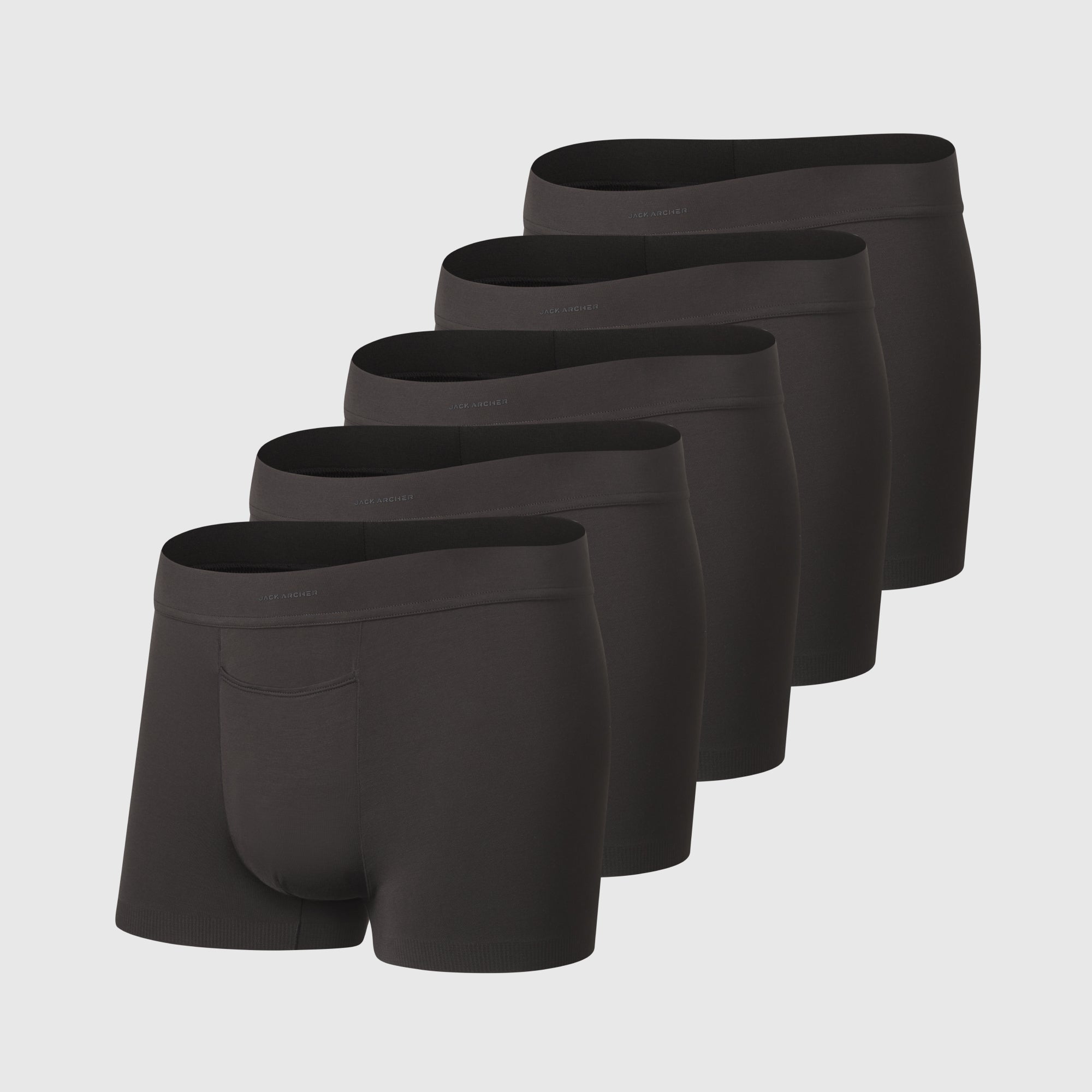 Black men’s boxer briefs on a plain background.