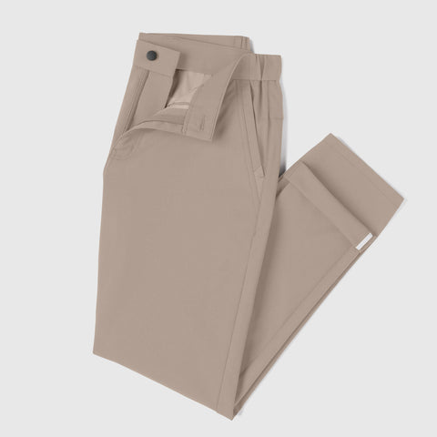 Jetsetter Tech Pant Slim Fit in beige, wrinkle-free, stain repellent, anti-odor fabric, folded display.