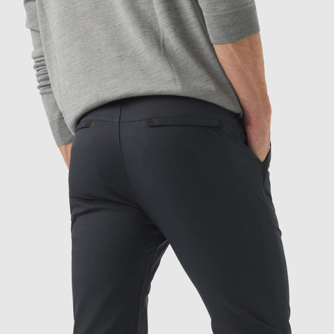 Jetsetter Tech Pant Slim Fit in dark color, showcasing wrinkle-free, stain-repellent material with premium stitching.