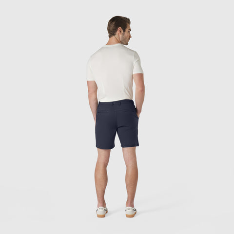 Man wearing Jetsetter Tech Short in navy blue showing a comfortable fit.