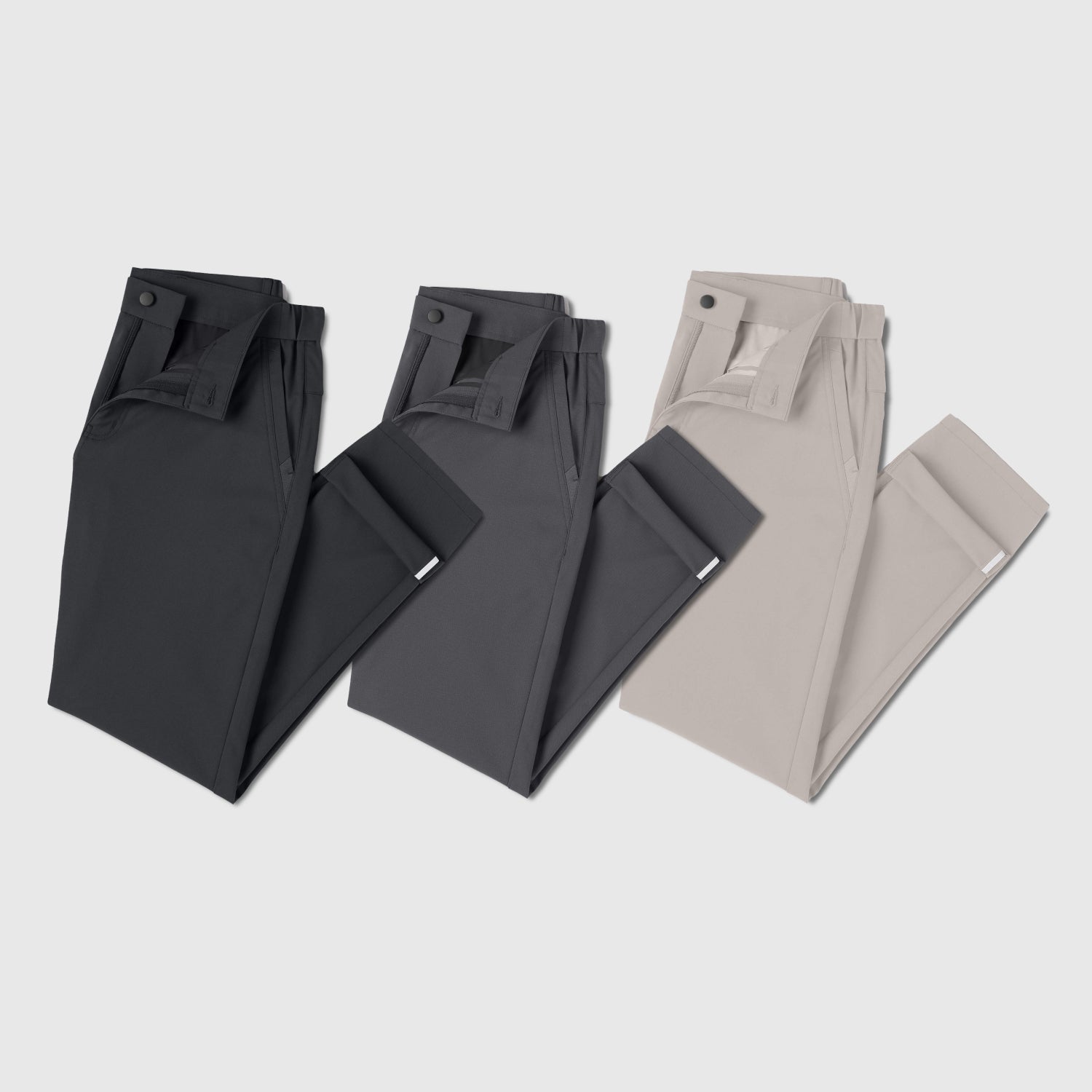 Folded beige pants on a light background.