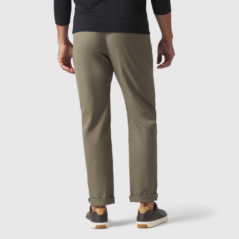 Jetsetter Tech Pant Straight Fit in khaki, shown from the back with cuffed hems.