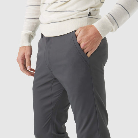 Jetsetter Tech Pant Slim Fit in dark color, showcasing wrinkle-free, anti-odor, and stain repellent features.