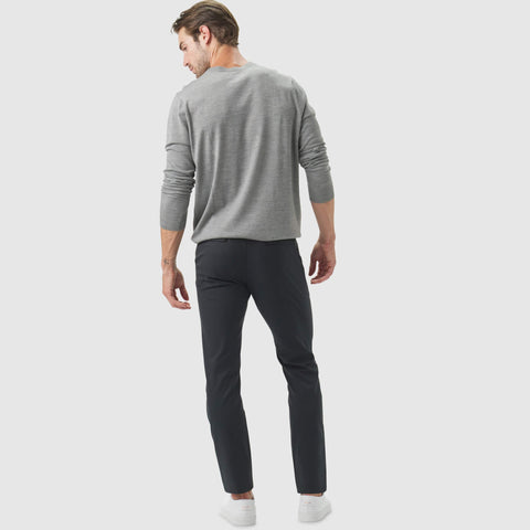 Jetsetter Tech Pant Slim Fit in use, highlighting wrinkle-free, stain repellent, travel-friendly design.