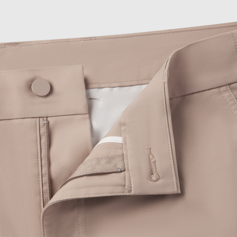 Slim fit Jetsetter Tech Pant with button closure and zipper detail.