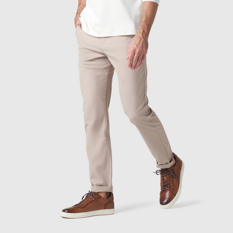 Jetsetter Tech Pant Slim Fit in beige, showcasing wrinkle-free, anti-odor fabric with reflective cuffs and premium stitching.