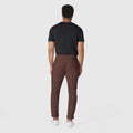 Jetsetter Tech Pant Slim Fit in brown, featuring wrinkle-free, anti-odor, and stain-repellent microfiber fabric.