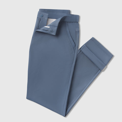 Slim fit Jetsetter Tech Pant in blue, showcasing durable, wrinkle-free microfiber fabric and premium design features.