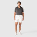 Jetsetter Tech Short for men in white with a consistent fit, showcased with a casual polo shirt.