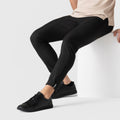 Jetsetter Tech Pant Slim Fit in black, showcasing wrinkle-free, stain-repellent fabric with anti-odor and rebound stretch features.