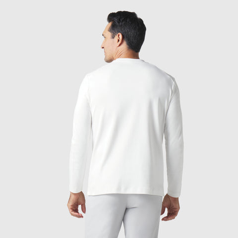 Precision Long Sleeve Tee in white organic cotton, hypoallergenic and wrinkle-resistant, viewed from the back worn by a model.