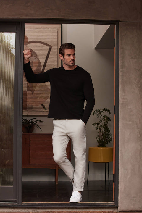 Precision Long Sleeve Tee in black, crafted from soft organic cotton, emphasizing shoulders for a tailored fit.