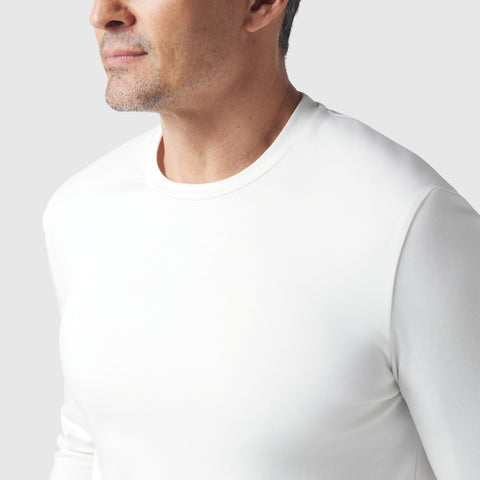 Man wearing the Precision Long Sleeve Tee made from soft organic cotton.