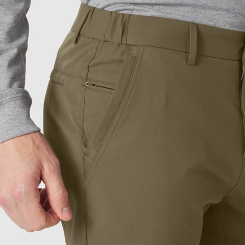 Jetsetter Tech Pant Slim Fit in olive green, showcasing wrinkle-free and stretchable fabric with a tailored cut.